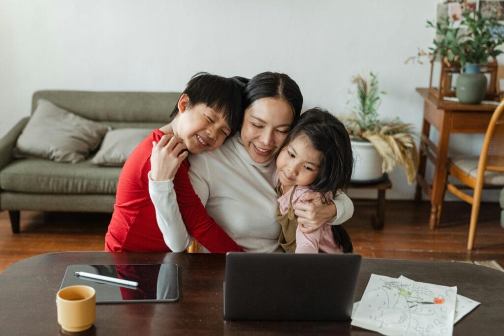 Global Mobility Solutions, Lady and kids doing research on a Laptop